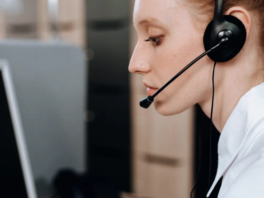 Support coordinator wearing a headset