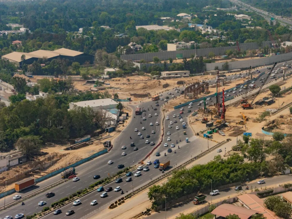 Aerial view of an expressway with trucks and cars