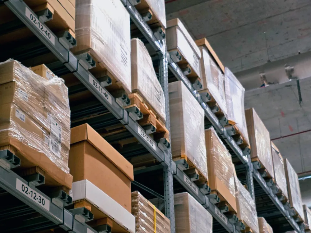 Warehouse racks stacked with cartons